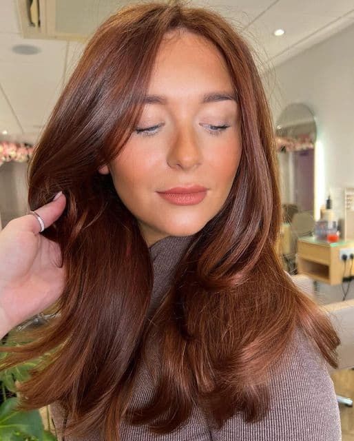 There is a style of Copper Peach Hair that feature wiry curls and face framing layers.